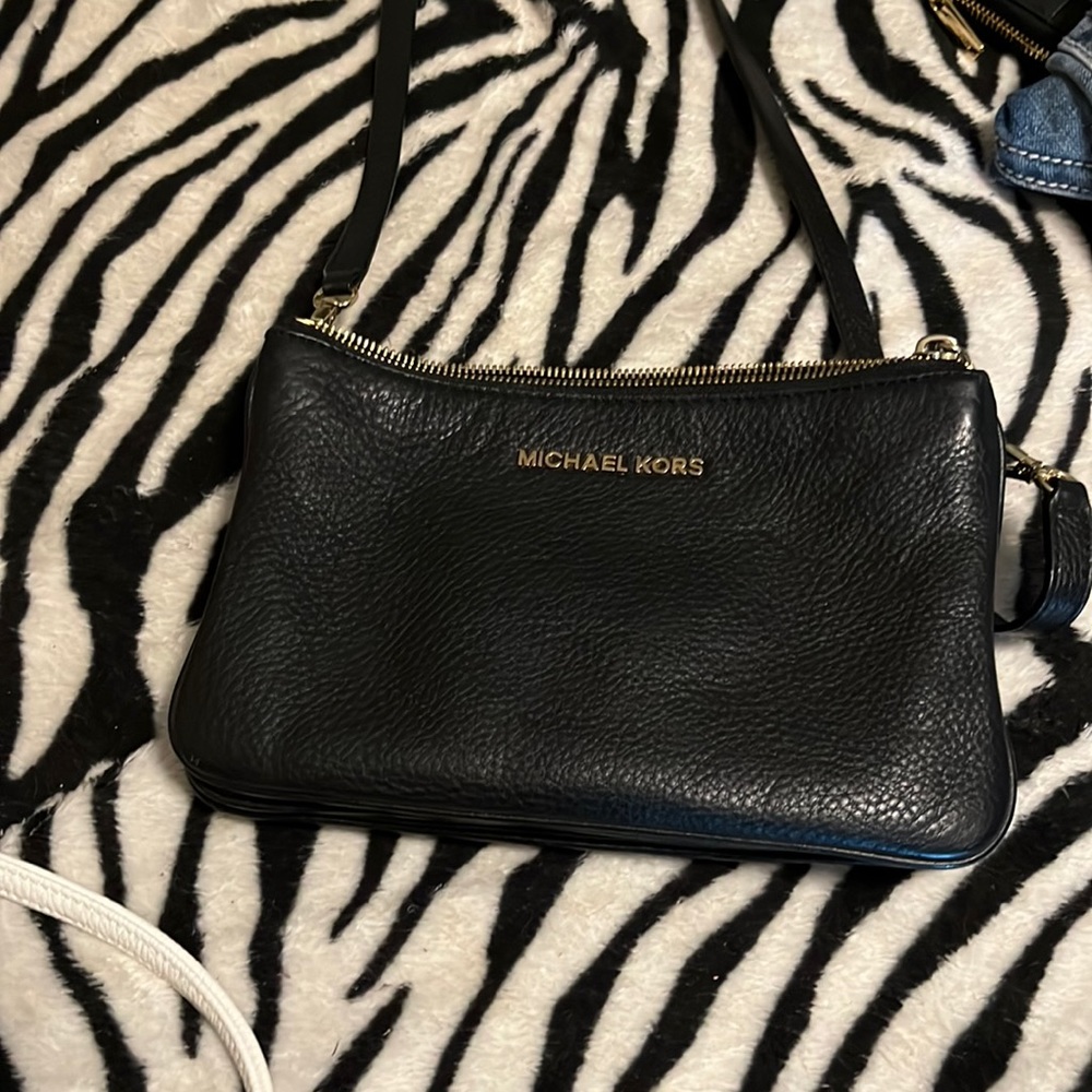 Michael kors  purse. Black with gold zipper. Cross body. No rips or tears